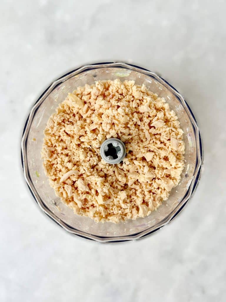 Shredded rotisserie chicken pulsed in a food processor for easy Round Swamp Farm chicken salad copycat recipe.