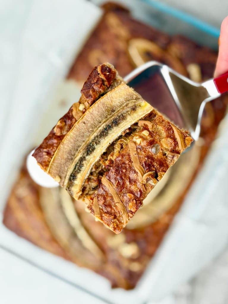 Single square of banana bread baked oatmeal on a spatula