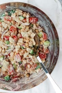 Greek yogurt caesar dressing ingredients in a mixing bowl