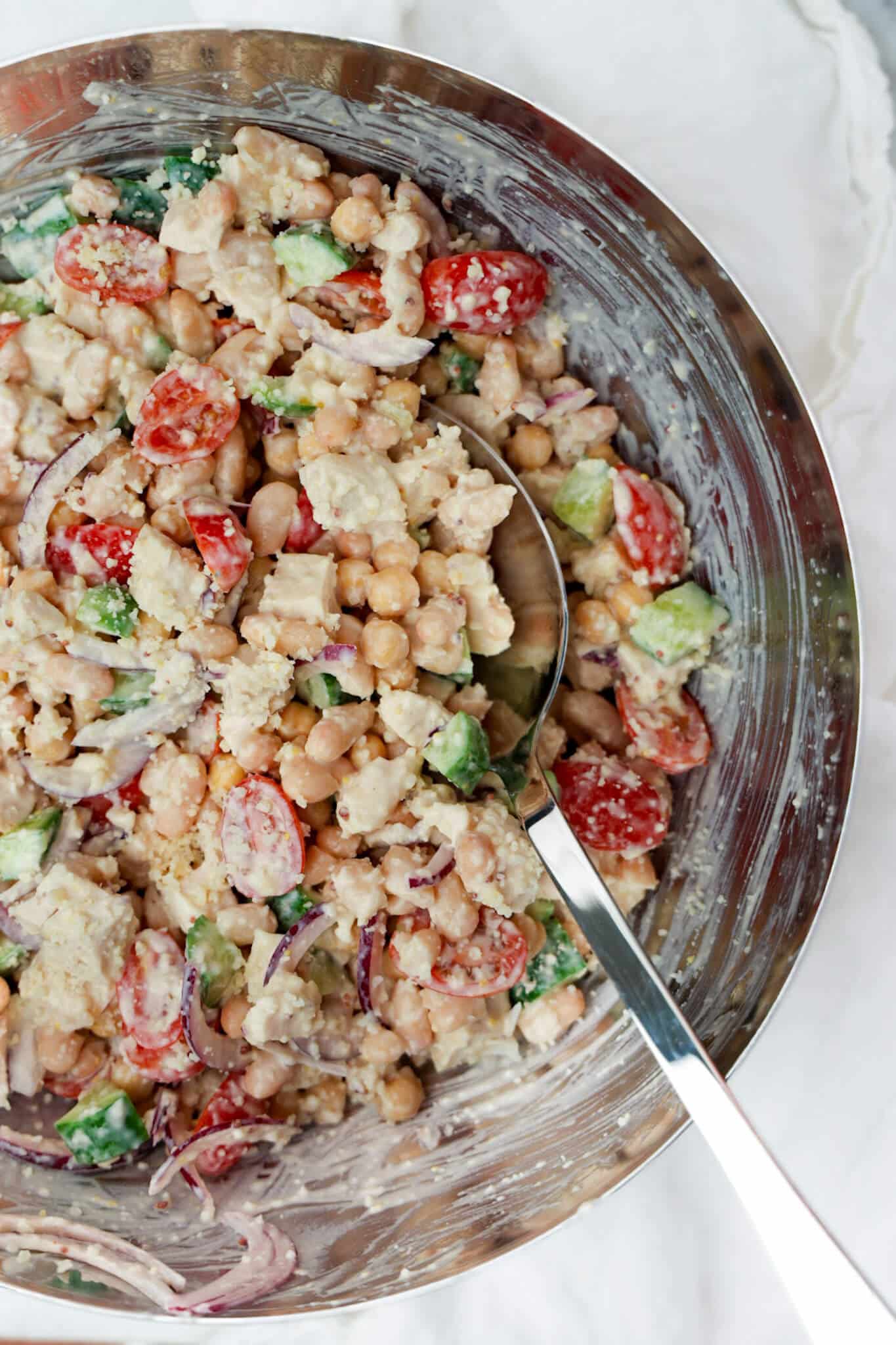 Greek yogurt caesar dressing ingredients in a mixing bowl