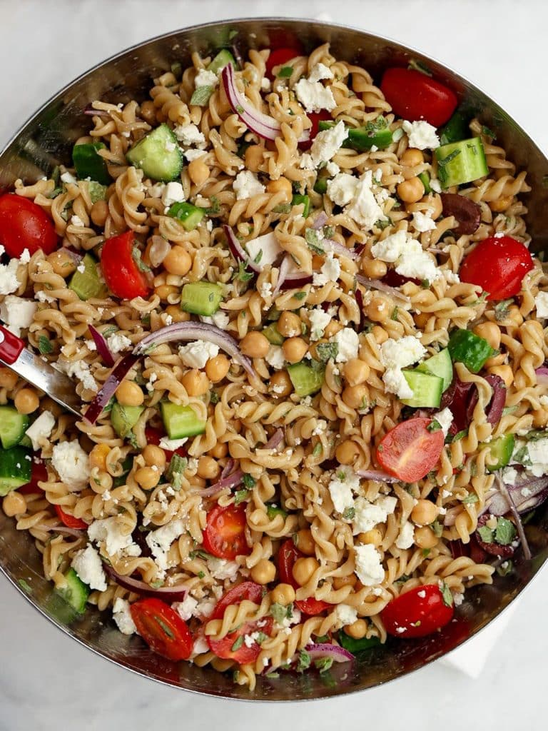 Large bowl of the best Mediterranean pasta salad tossed with Greek vinaigrette