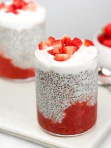 Strawberry chia pudding recipe served in two glasses with yogurt and fresh strawberries