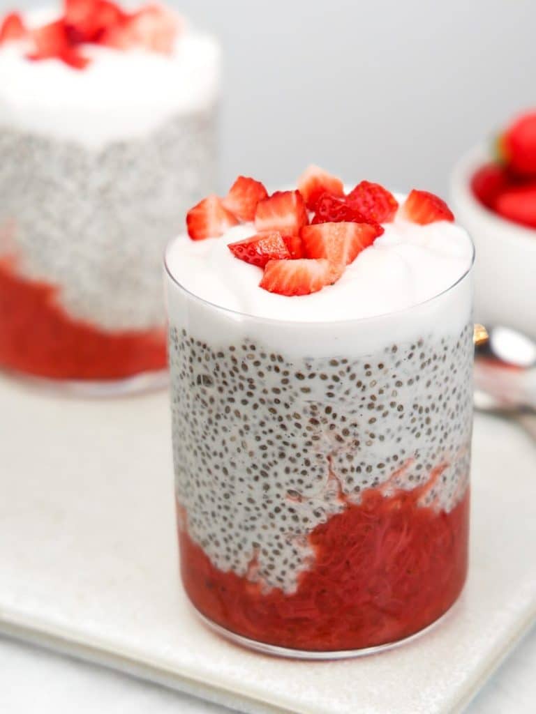 Strawberry chia pudding recipe served in two glasses with yogurt and fresh strawberries