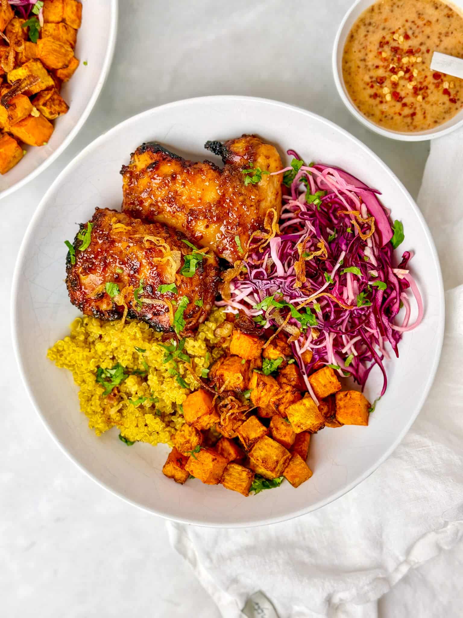 Sweetgreen hot honey chicken bowl copycat with crispy chicken thighs, kale, sweet potato, and goat cheese over wild rice