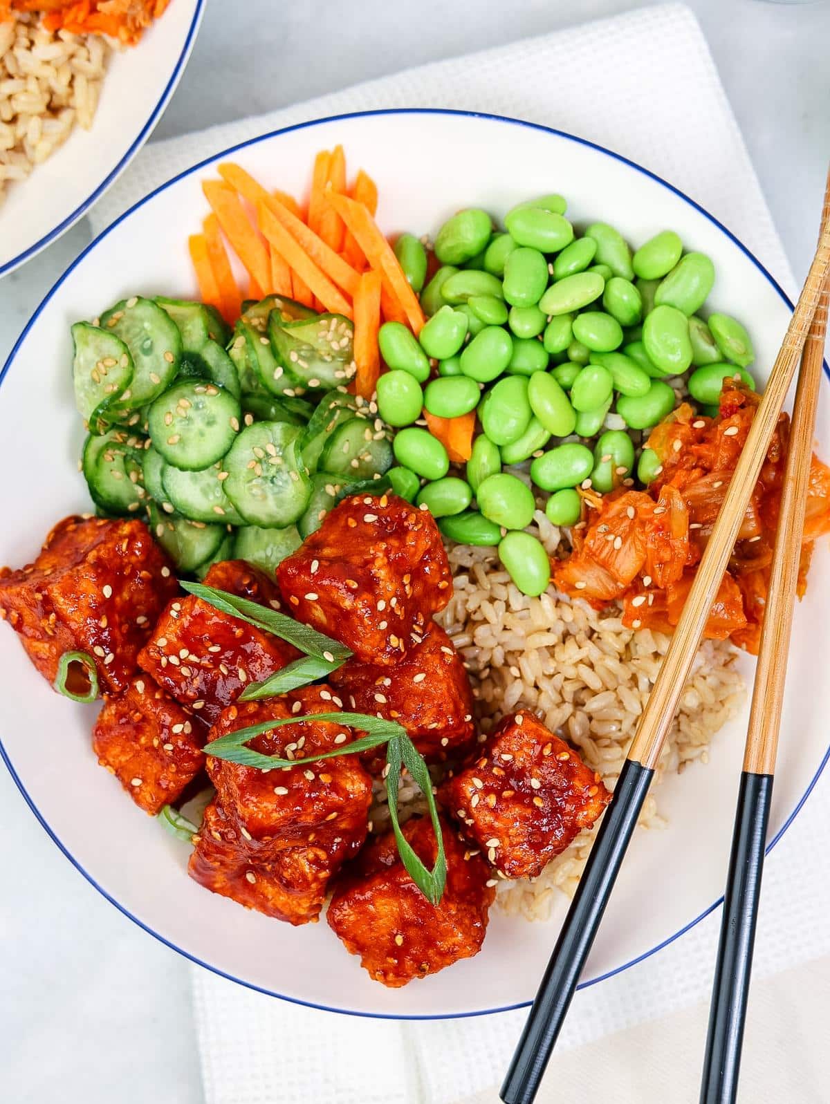 Gochujang crispy air fryer tofu bowl with sticky sweet spicy sauce over rice