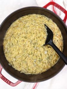 Creamy lemon orzo simmering with fresh dill