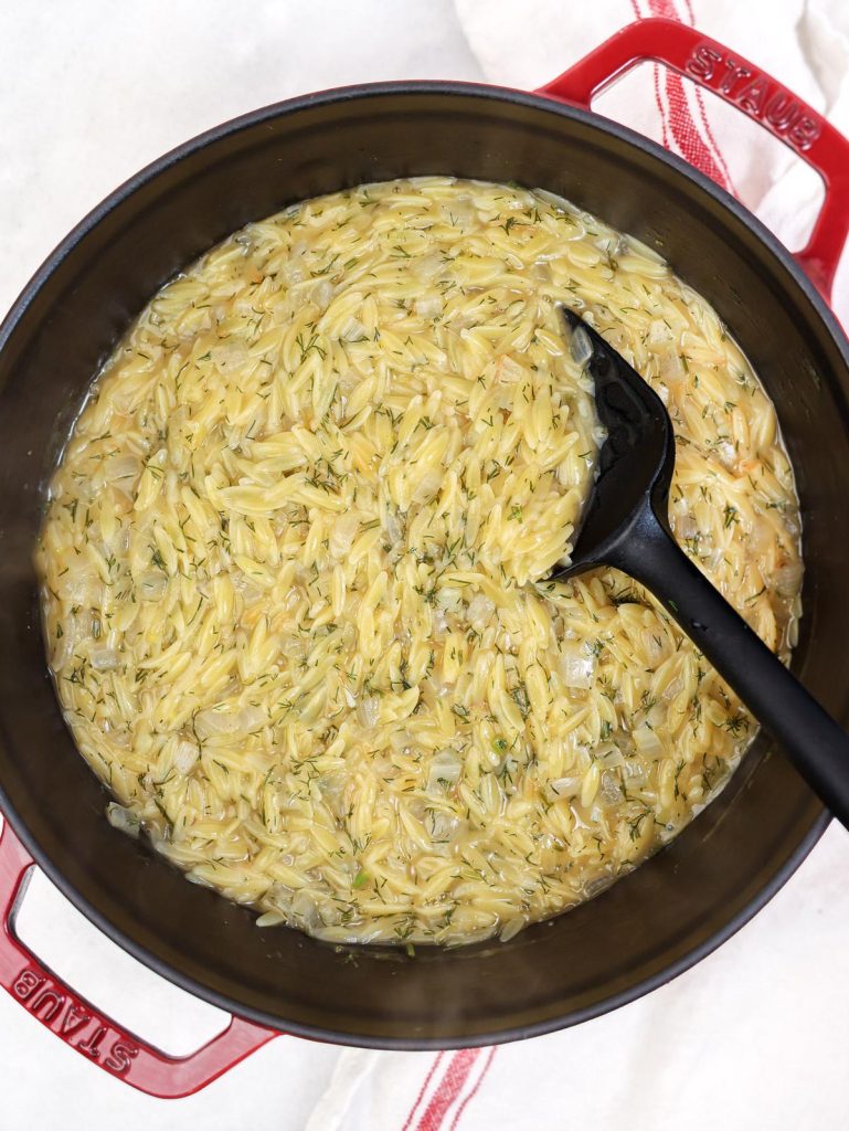 Creamy lemon orzo simmering with fresh dill