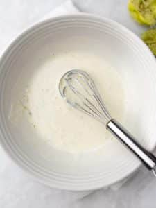 Whisked creamy lime greek yogurt cashew chicken salad dressing
