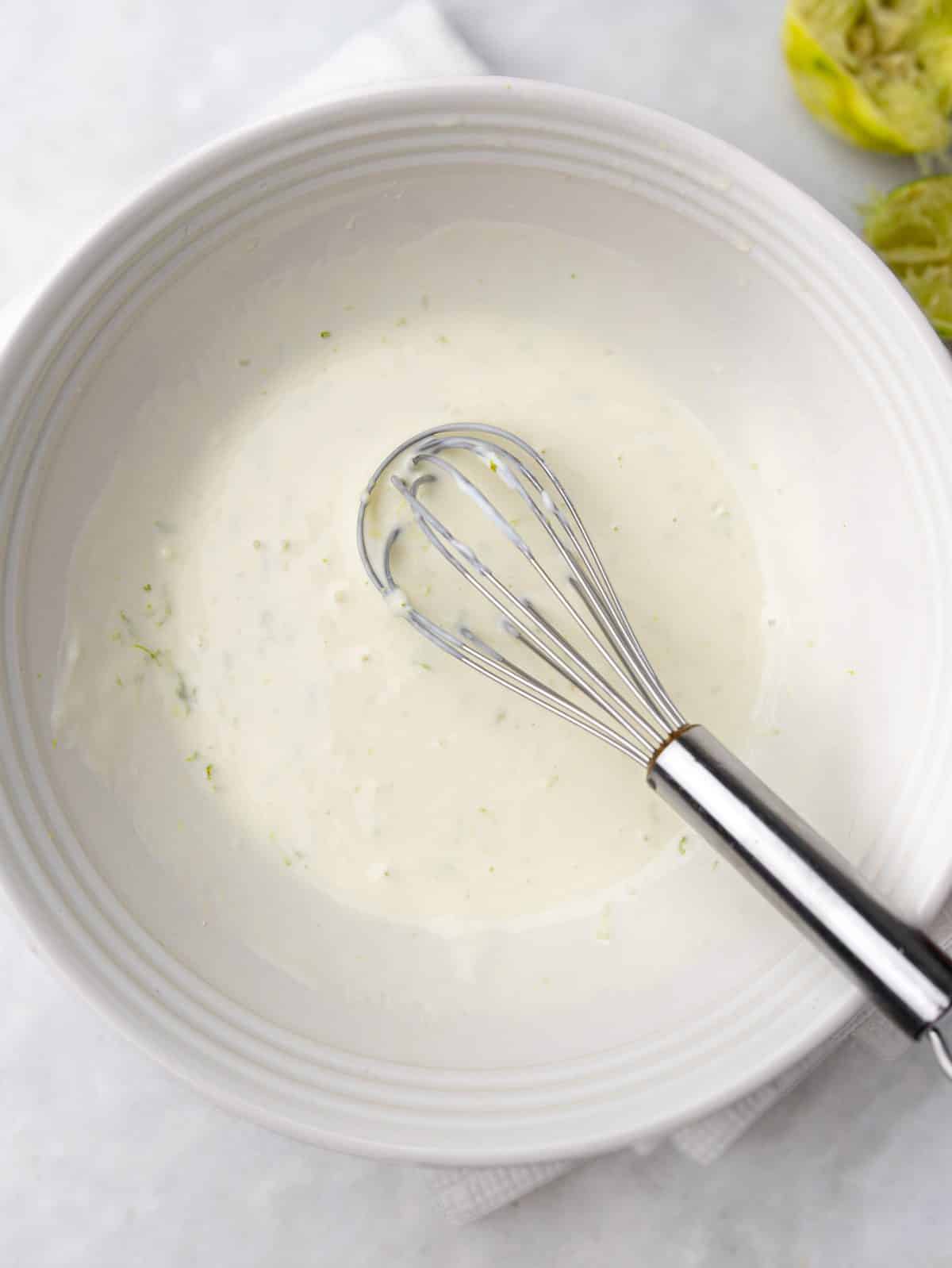 Whisked creamy lime greek yogurt cashew chicken salad dressing