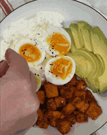 Topping the cottage cheese breakfast bowl with everything bagel seasoning and microgreens