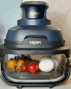 Air frying cherry tomatoes and eggs together in a Ninja air fryer for a savory greek yogurt bowl