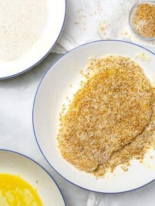 Chicken cutlet dredged in panko and sesame seed coating with flour and egg