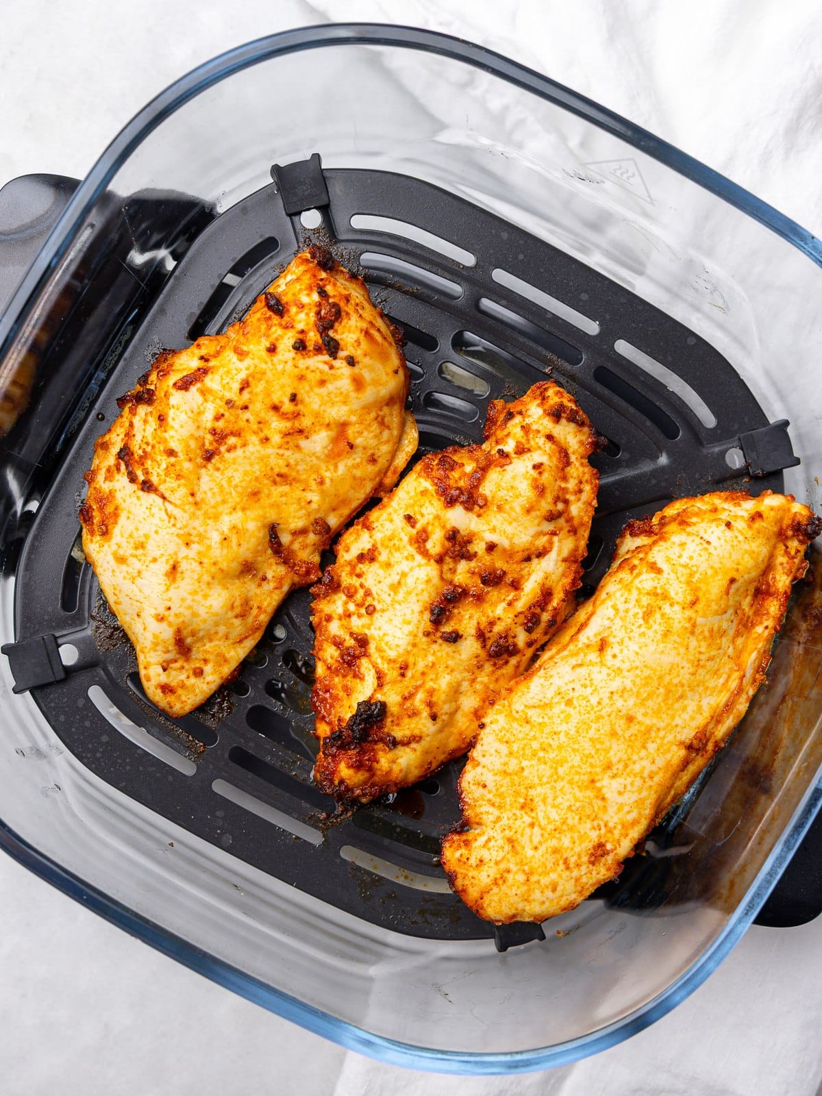 Seasoned chicken breasts cooked in the air fryer for buffalo chicken pasta salad