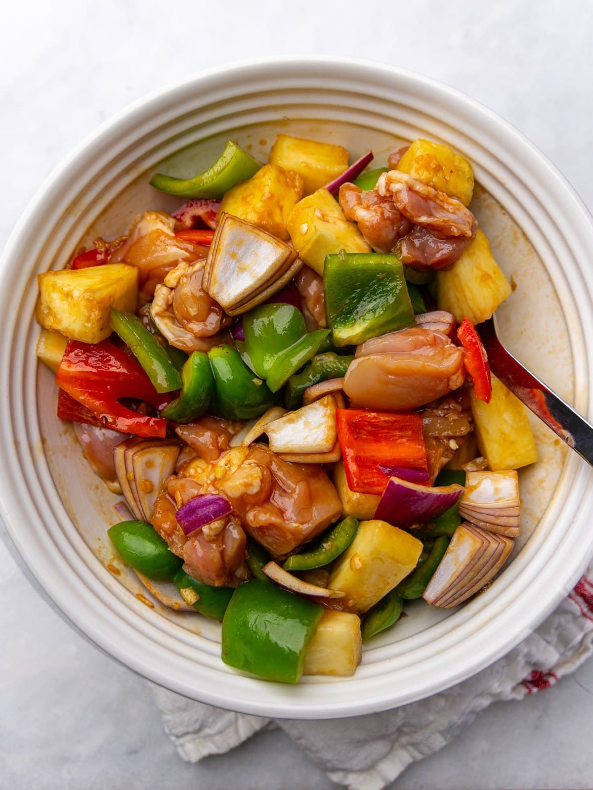 Cubed chicken thighs, fresh pineapple, bell peppers, and red onion tossed in hawaiian marinade
