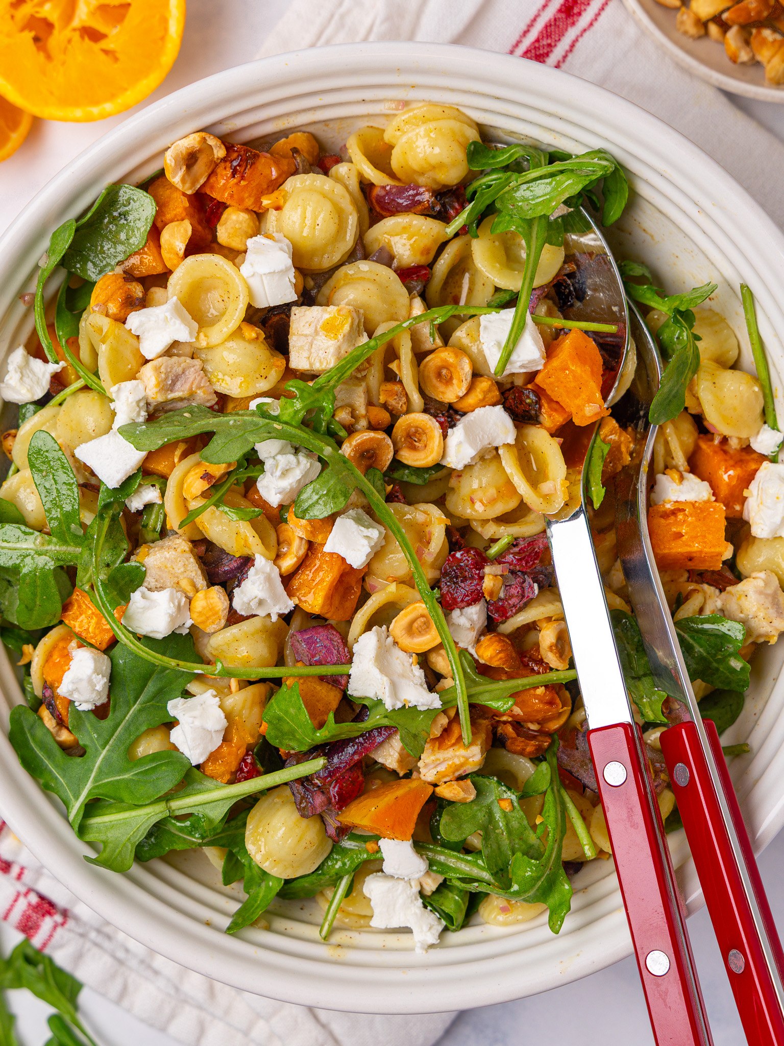 Fall pasta salad with orecchiette, roasted squash, goat cheese and toasted hazelnuts, seen from above